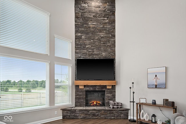 6330 Teakwood Way, Mccordsville, IN 46055 - living area featuring a stone fireplace, wood finished floors, and a high ceiling