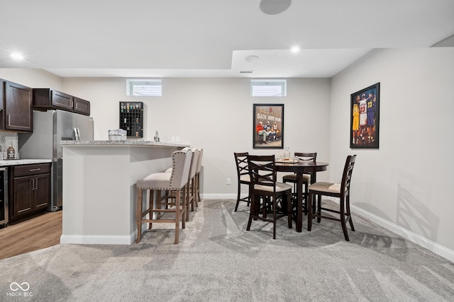 6330 Teakwood Way, Mccordsville, IN 46055 - dining area with wet bar, light colored carpet, beverage cooler, and recessed lighting