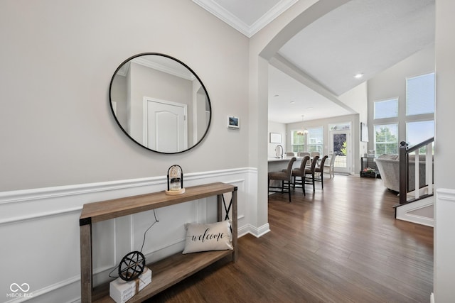 6330 Teakwood Way, Mccordsville, IN 46055 - hallway featuring dark wood finished floors, crown molding, arched walkways, and a chandelier
