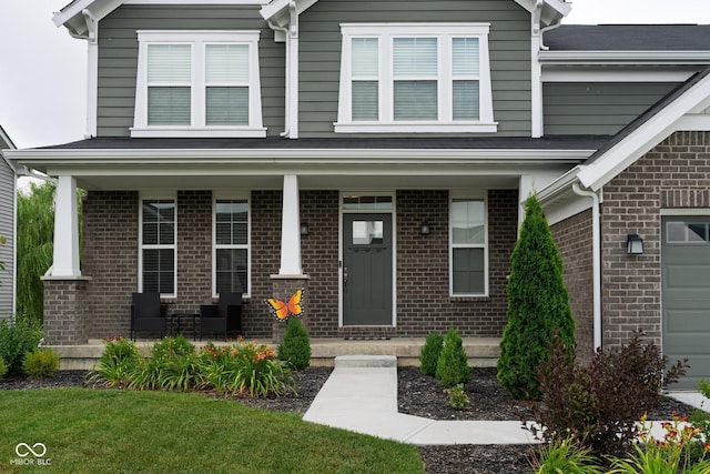 6330 Teakwood Way, Mccordsville, IN 46055 - view of front facade featuring a porch and brick siding