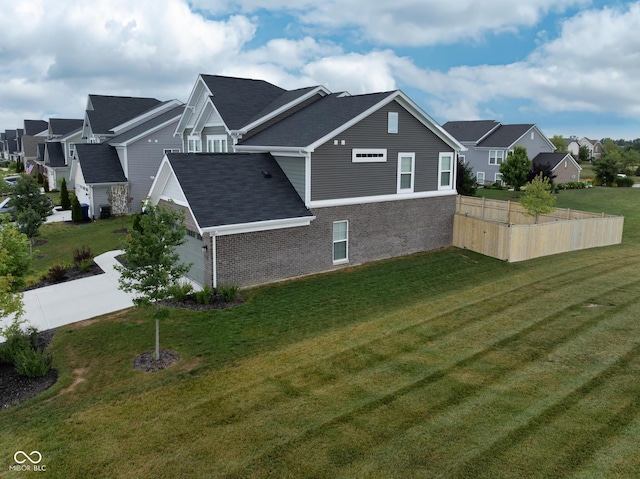 6330 Teakwood Way, Mccordsville, IN 46055 - view of home's exterior featuring brick siding, a residential view, roof with shingles, and concrete driveway