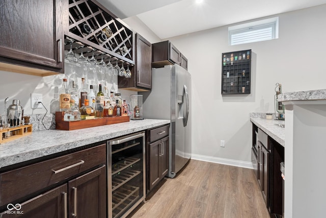 6330 Teakwood Way, Mccordsville, IN 46055 - indoor dry bar with beverage cooler, stainless steel refrigerator with ice dispenser, and light wood-type flooring