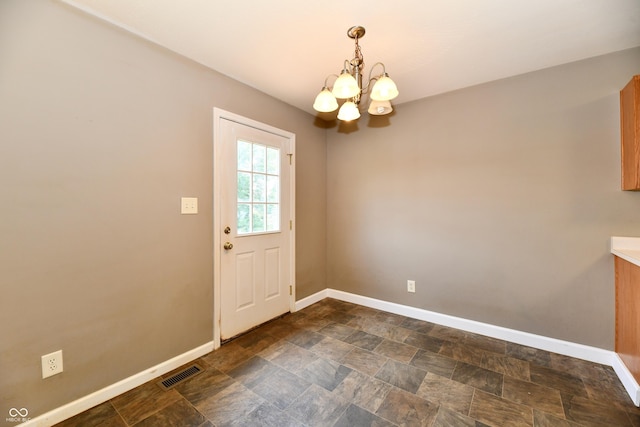 915 E Drybread Ln, Nineveh, IN 46164 - unfurnished dining area with a chandelier and stone finish floors