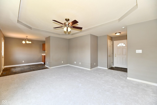 915 E Drybread Ln, Nineveh, IN 46164 - spare room featuring a tray ceiling, dark colored carpet, a chandelier, and ceiling fan