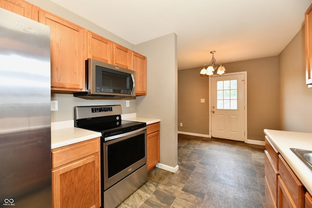 915 E Drybread Ln, Nineveh, IN 46164 - kitchen with appliances with stainless steel finishes, a chandelier, light countertops, and pendant lighting