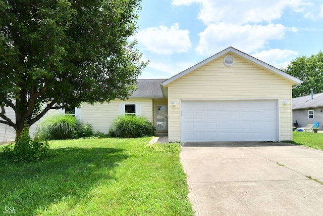 915 E Drybread Ln, Nineveh, IN 46164 - view of front of home featuring concrete driveway, a front lawn, and an attached garage