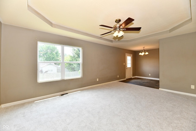 915 E Drybread Ln, Nineveh, IN 46164 - empty room with a raised ceiling, a chandelier, dark colored carpet, and a ceiling fan