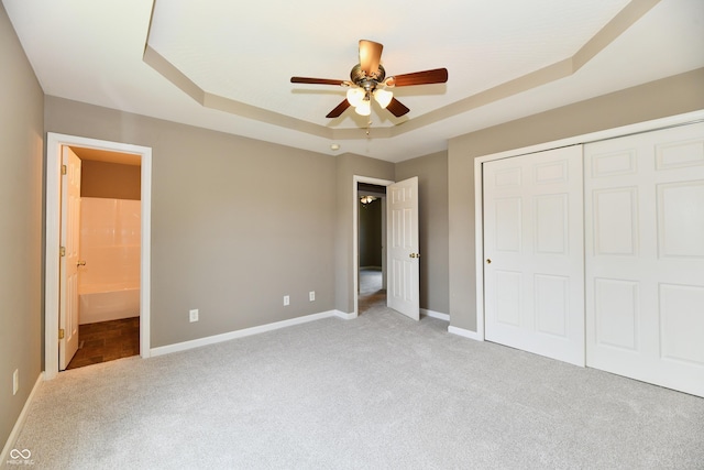 915 E Drybread Ln, Nineveh, IN 46164 - unfurnished bedroom with carpet, a tray ceiling, a closet, and ensuite bath