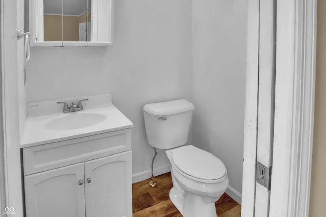 2433 17th St, Columbus, IN 47201 - half bath featuring vanity and wood finished floors