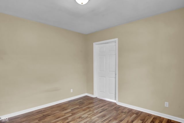 2433 17th St, Columbus, IN 47201 - spare room featuring baseboards and wood finished floors