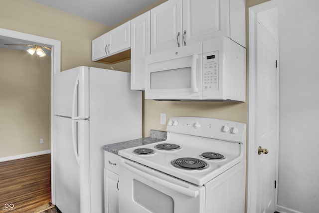 2433 17th St, Columbus, IN 47201 - kitchen featuring white appliances, white cabinetry, wood finished floors, and ceiling fan