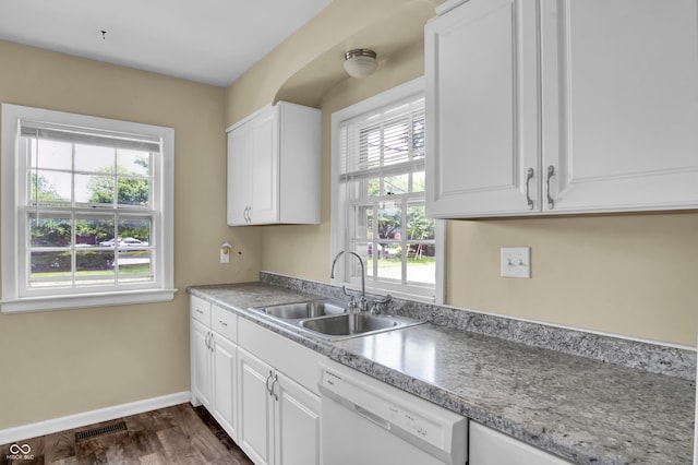 2433 17th St, Columbus, IN 47201 - kitchen featuring dishwasher, plenty of natural light, and white cabinetry