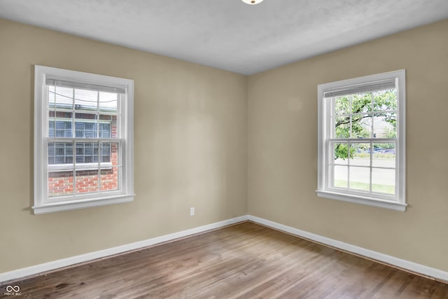 2433 17th St, Columbus, IN 47201 - unfurnished room with baseboards and wood finished floors