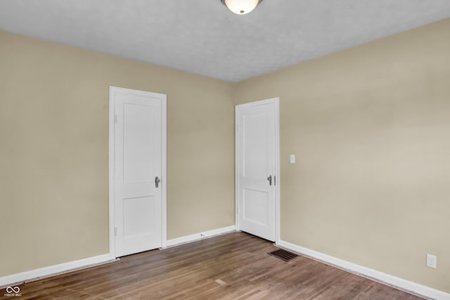 2433 17th St, Columbus, IN 47201 - unfurnished room with baseboards and wood finished floors