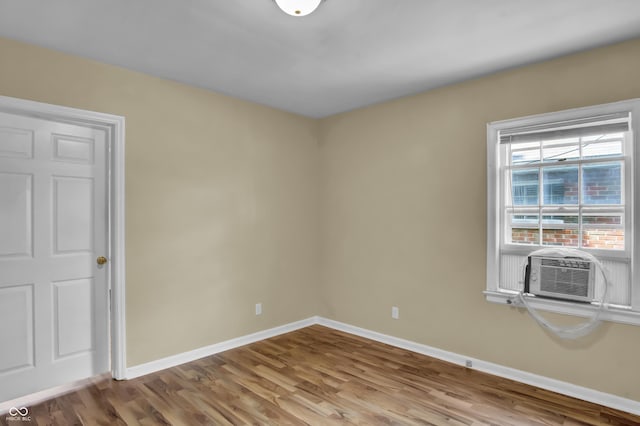 2433 17th St, Columbus, IN 47201 - spare room with wood finished floors and cooling unit