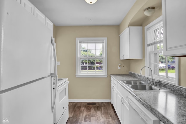 2433 17th St, Columbus, IN 47201 - kitchen with white appliances, healthy amount of natural light, dark wood-style floors, and white cabinetry