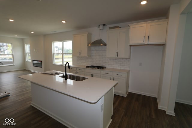 1825 Real St, Indianapolis, IN 46240 - kitchen featuring white cabinets, dark wood finished floors, a center island with sink, tasteful backsplash, and recessed lighting