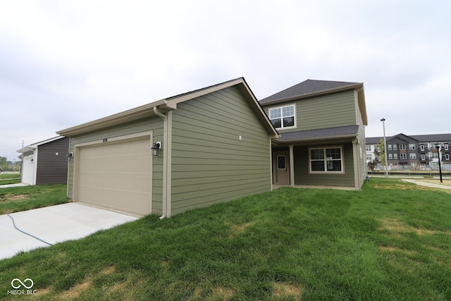 1825 Real St, Indianapolis, IN 46240 - view of front of property with a front yard, concrete driveway, and a garage