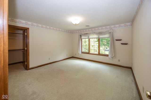 1112 N Dogwood Way, Greenfield, IN 46140 - empty room with light colored carpet and baseboards
