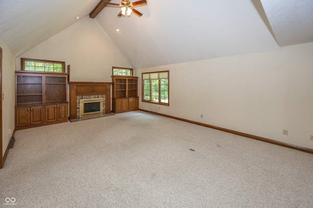 1112 N Dogwood Way, Greenfield, IN 46140 - unfurnished living room featuring ceiling fan, carpet, a fireplace with flush hearth, high vaulted ceiling, and beamed ceiling