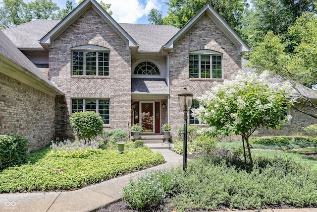 1112 N Dogwood Way, Greenfield, IN 46140 - view of front facade featuring brick siding and a shingled roof
