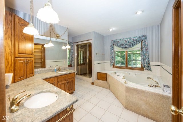1112 N Dogwood Way, Greenfield, IN 46140 - bathroom with wallpapered walls, tile patterned floors, vanity, a garden tub, and a stall shower