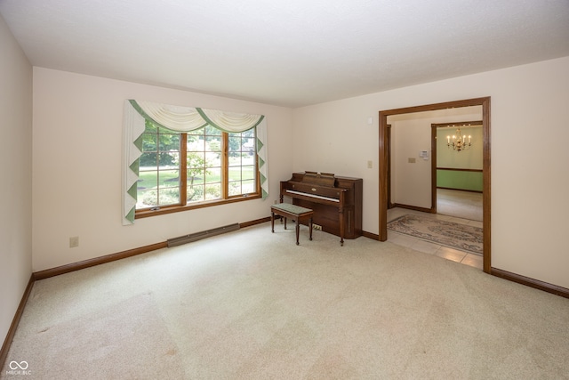1112 N Dogwood Way, Greenfield, IN 46140 - living area with carpet flooring, a baseboard heating unit, and a chandelier