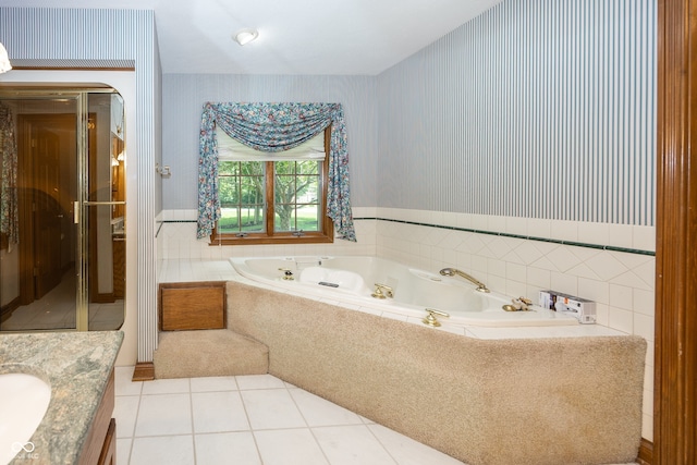 1112 N Dogwood Way, Greenfield, IN 46140 - bathroom featuring tile patterned floors, wallpapered walls, a wainscoted wall, a garden tub, and vanity