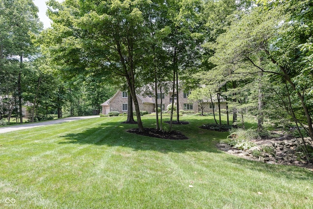 1112 N Dogwood Way, Greenfield, IN 46140 - view of green lawn featuring driveway