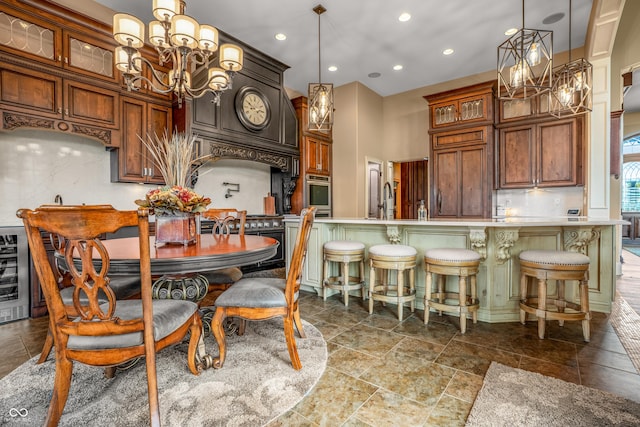 3075 Hurricane Rd, Franklin, IN 46131 - kitchen featuring a chandelier, light countertops, gas range oven, glass insert cabinets, and recessed lighting