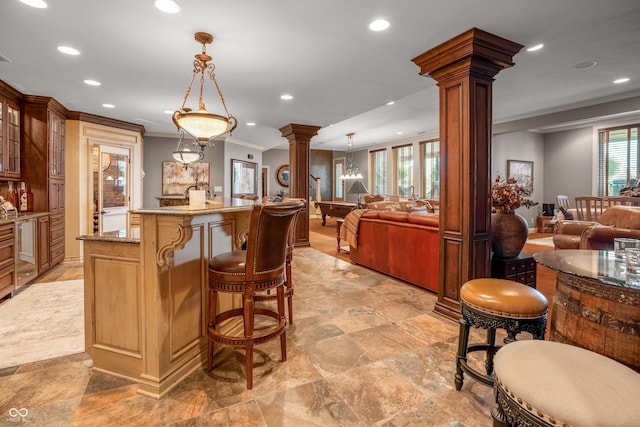 3075 Hurricane Rd, Franklin, IN 46131 - kitchen featuring ornate columns, open floor plan, recessed lighting, crown molding, and glass insert cabinets