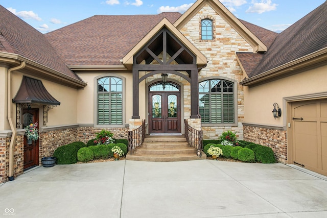3075 Hurricane Rd, Franklin, IN 46131 - entrance to property with french doors, stone siding, stucco siding, and a shingled roof