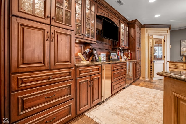 3075 Hurricane Rd, Franklin, IN 46131 - kitchen featuring wine cooler, ornamental molding, recessed lighting, stone countertops, and glass insert cabinets