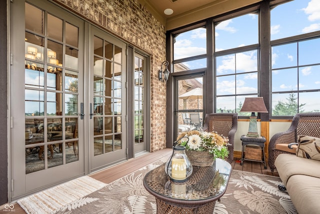 3075 Hurricane Rd, Franklin, IN 46131 - sunroom / solarium with french doors, wood finished floors, and brick wall