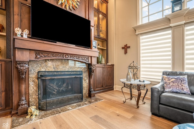 3075 Hurricane Rd, Franklin, IN 46131 - living area with light wood-style floors and a high end fireplace