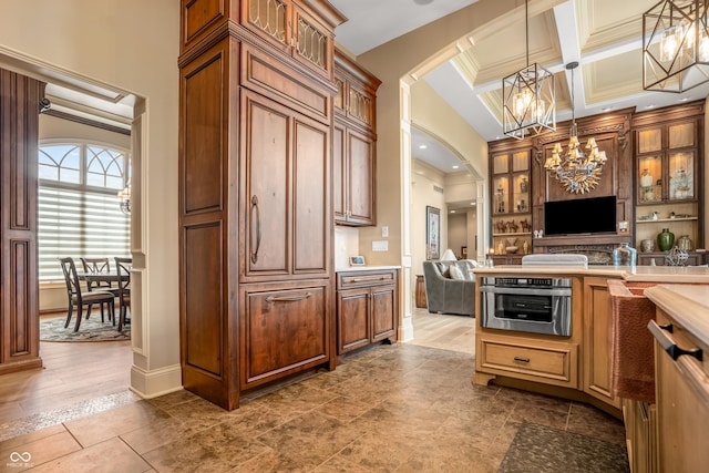 3075 Hurricane Rd, Franklin, IN 46131 - kitchen featuring a chandelier, open floor plan, decorative light fixtures, light countertops, and coffered ceiling