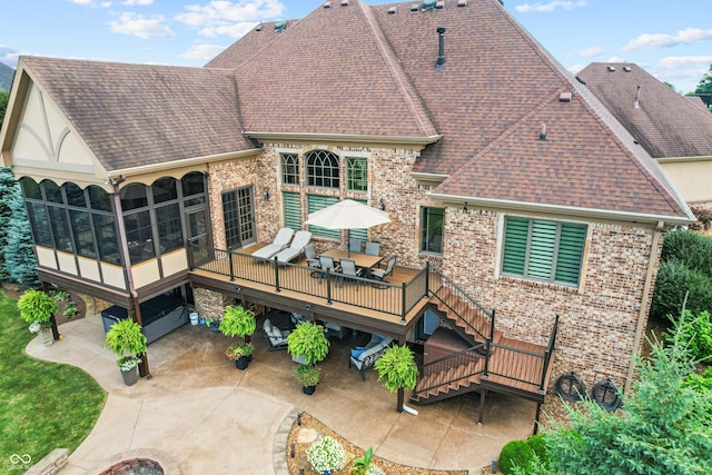 3075 Hurricane Rd, Franklin, IN 46131 - back of house with a sunroom, a patio, a shingled roof, and outdoor dining space