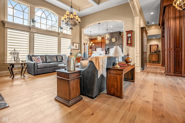 3075 Hurricane Rd, Franklin, IN 46131 - living room featuring a chandelier, a towering ceiling, light wood finished floors, arched walkways, and coffered ceiling