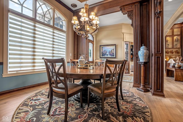 3075 Hurricane Rd, Franklin, IN 46131 - dining area featuring light wood-style floors, ornamental molding, and a chandelier