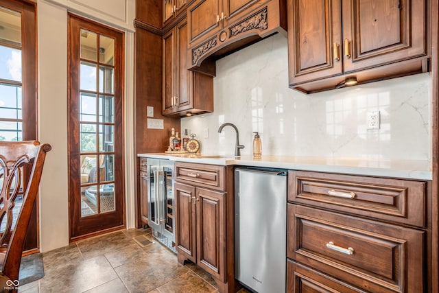 3075 Hurricane Rd, Franklin, IN 46131 - kitchen with backsplash, light countertops, beverage cooler, and brown cabinets