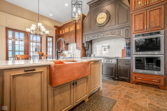 3075 Hurricane Rd, Franklin, IN 46131 - kitchen featuring stainless steel double oven, a chandelier, glass insert cabinets, light countertops, and hanging light fixtures