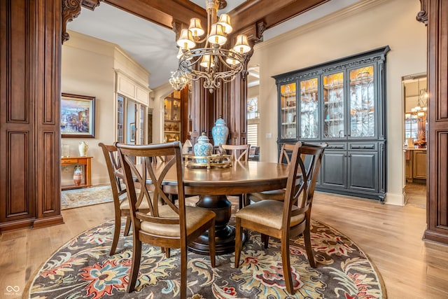 3075 Hurricane Rd, Franklin, IN 46131 - dining room with a chandelier, light wood-style flooring, and crown molding