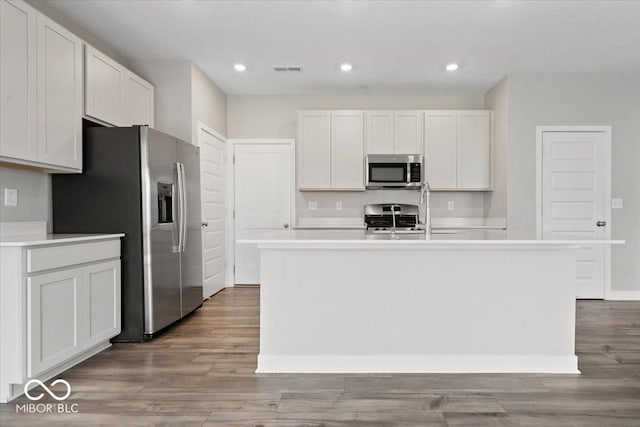 11431 Hartwell St, Indianapolis, IN 46235 - kitchen featuring appliances with stainless steel finishes, light wood-type flooring, light countertops, and recessed lighting