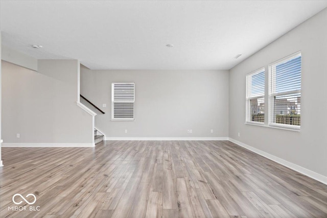 11431 Hartwell St, Indianapolis, IN 46235 - spare room with light wood-style floors and stairs