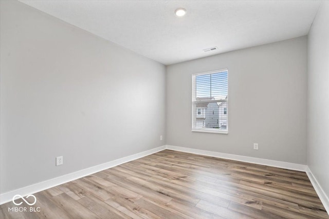 11431 Hartwell St, Indianapolis, IN 46235 - empty room with wood finished floors and baseboards
