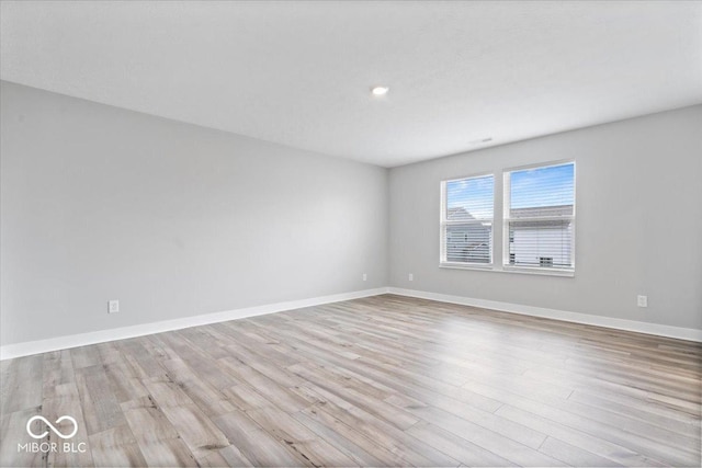 11431 Hartwell St, Indianapolis, IN 46235 - empty room with wood finished floors and recessed lighting