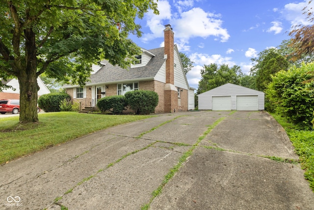 2752 Vinewood Dr, Speedway, IN 46224 - view of front of property with brick siding, a detached garage, an outdoor structure, a chimney, and a front lawn