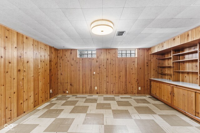 2752 Vinewood Dr, Speedway, IN 46224 - basement featuring wood walls and light flooring