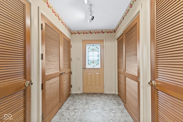 2752 Vinewood Dr, Speedway, IN 46224 - doorway to outside featuring baseboards and light flooring