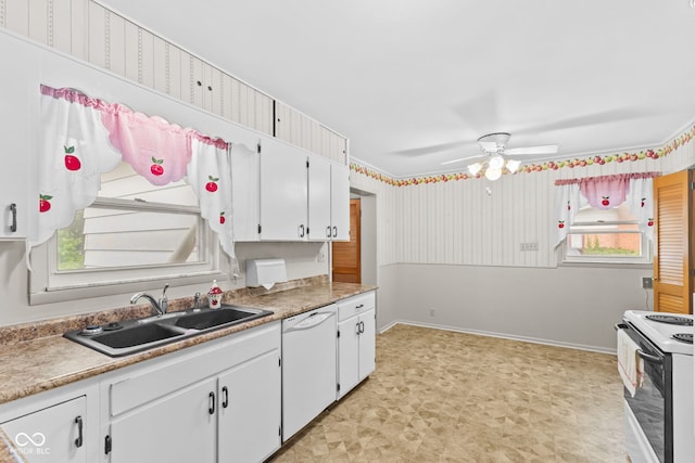 2752 Vinewood Dr, Speedway, IN 46224 - kitchen with white dishwasher, electric range, light flooring, and white cabinets